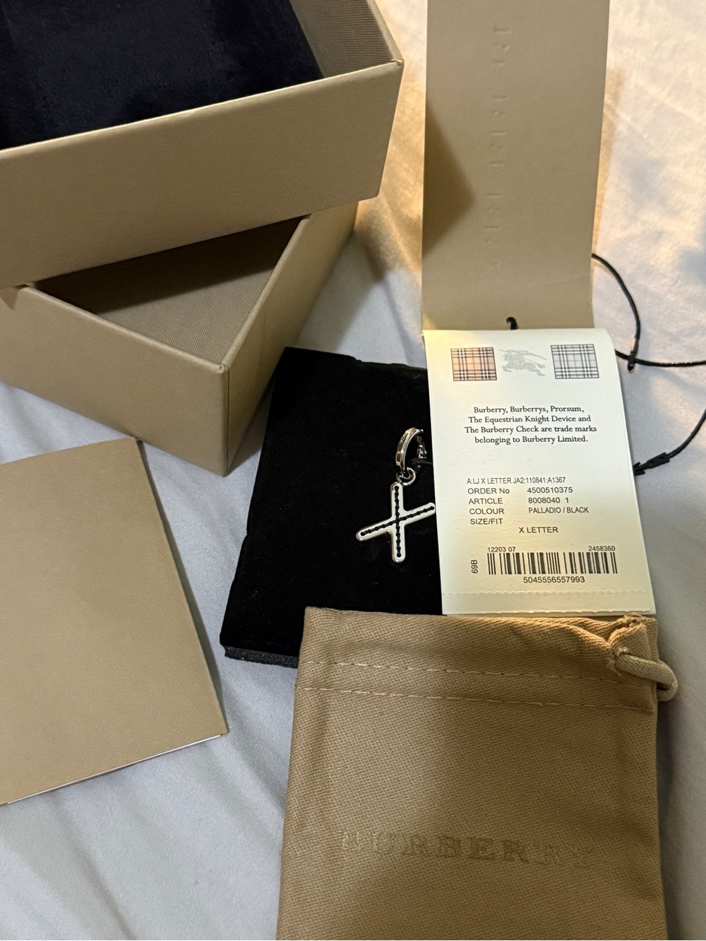 NWB Burberry Palladio X Letter Charm Pendant comes w/ everything and dust bag.